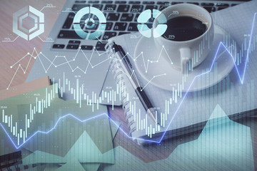 Multi exposure of forex graph drawing and desktop with coffee and items on table background. Concept of financial market trading