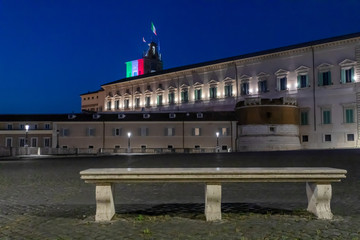 Naklejka premium Palazzo del Quirinale, illuminated with the colors of the Italian flag, in the evening in the blue hour.