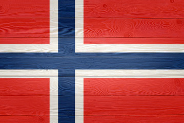 Norway flag painted on old wood plank background. Brushed natural light knotted wooden board texture. Wooden texture background flag of Norway.