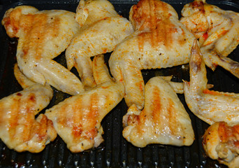 Homemade food grilled chicken wings in sauce