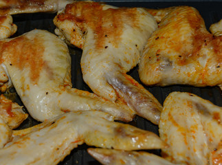 Homemade food grilled chicken wings in sauce