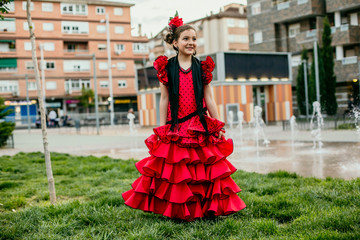 Fototapeta na wymiar girl dressed in red flamenco dress