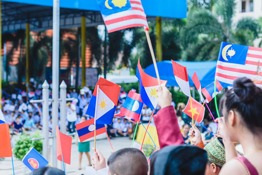Celebrate ASEAN Day falls on Aug. 8,Students hand holding carry the flag of of the Association of Southeast Asian Nations,Celebrating 47 years of ASEAN