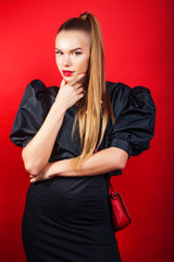 young pretty woman young lady posing on red background, lifestyle people concept