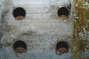 Iron plate with holes. rough metal texture. steel background