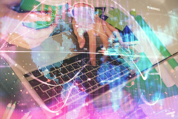 Double exposure of woman hands typing on computer and business theme hologram drawing. Success concept.