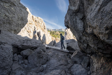 The rock in Crimea. The place on Black sea. Backpacker on nature.