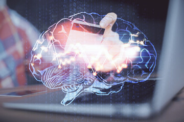 Double exposure of man hands typing on computer with credit card and brain theme drawing....