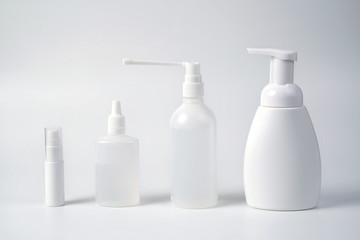 Medical antiseptic and hygiene products, hand sanitizers are used to destroy microbes, bacteria and viruses: gel, antibacterial agent, alcohol solution, medical solution. White bottles on a white