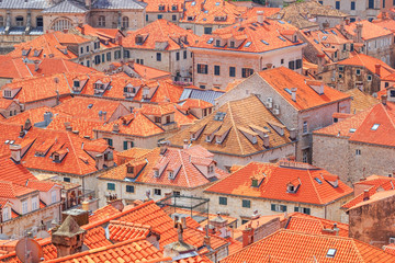 Fototapeta na wymiar Summer mediterranean cityscape - view of the roofs of the Old Town of Dubrovnik, on the Adriatic coast of Croatia