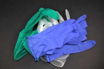 Abstract view of crumpled medical gloves isolated on white background. Close up photo.