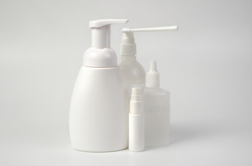 Medical antiseptic and hygiene products, hand sanitizers are used to destroy microbes, bacteria and viruses: gel, antibacterial agent, alcohol solution, medical solution. White bottles on a white