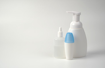 Medical antiseptic and hygiene products, hand sanitizers are used to destroy microbes, bacteria and viruses: gel, antibacterial agent, alcohol solution, medical solution. White bottles on a white