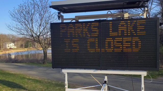 Electronic sign announces the closure of public parks in NJ during the Corona virus pandemic of 2020.