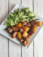 Gyuvech-traditional Balkan food with meat, potatoes and vegetables