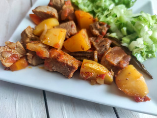 Gyuvech-traditional Balkan food with meat, potatoes and vegetables