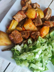 Gyuvech-traditional Balkan food with meat, potatoes and vegetables