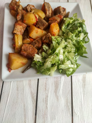 Gyuvech-traditional Balkan food with meat, potatoes and vegetables