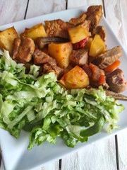 Gyuvech-traditional Balkan food with meat, potatoes and vegetables
