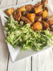 Gyuvech-traditional Balkan food with meat, potatoes and vegetables