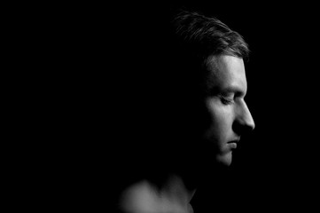 black and white dramatic portrait of a guy
