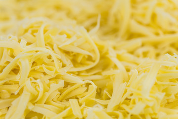 Fresh made Grated Cheese (close-up shot)