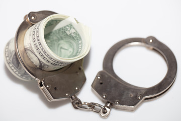 Obraz premium Dollar Bills With Handcuffs.