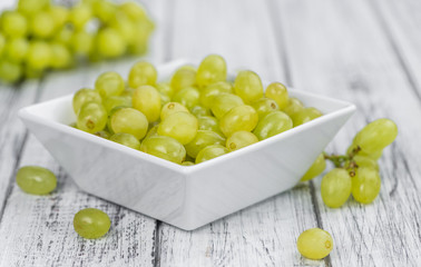 Portion of healthy White Grapes (selective focus; close-up shot)