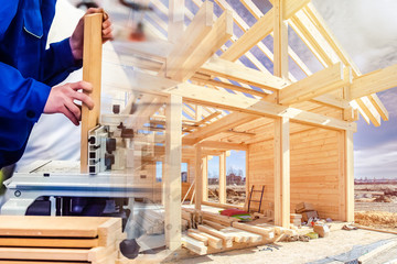 Construction of a cottage made of wood. Carpentry work on a construction site. Wood processing....