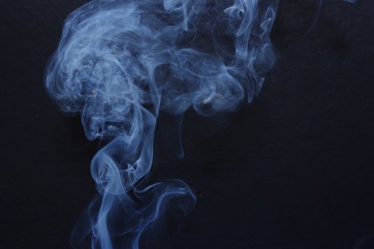Close-up Of Abstract Smoke Pattern Against Black Background