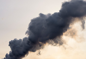 black thick smoke against the sky