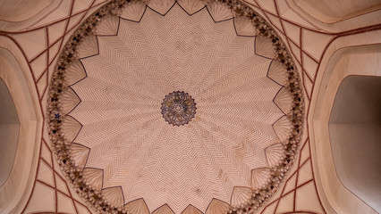 looking up at ceiling inside part of humayun's tomb