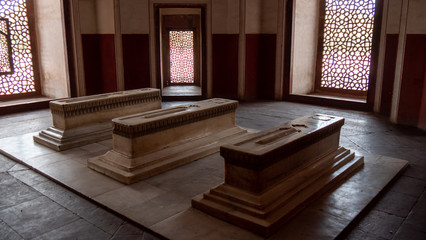side view of three stone coffins at humayun's tomb in delhi