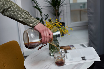 Alternating filter manual brewing of coffee close up. Devices for coffee in the background