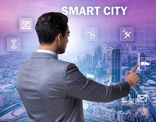 Concept of smart city with businessman pressing buttons