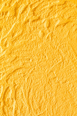 Yellow concrete wall texture. Luxury background for design on a building theme, decor theme. Handmade.