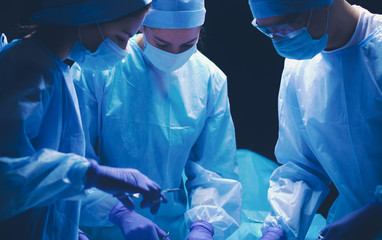 Team surgeon at work in operating room