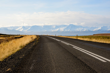 Curved road in Iceland leading to mountains