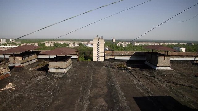 Chernobyl Exclusion Zone. Panorama of Prypiat from a skyscraper. Wide Dolly Shot