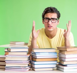 Student with too many books to read before exam