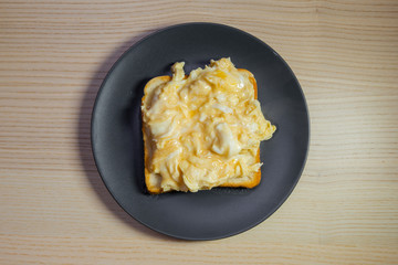 Scramble eggs on toast.