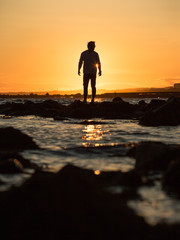 sunset portrait of a man on the beach