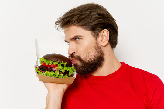 Young Man Eating A Salad