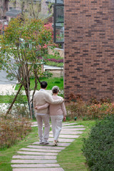 Fototapeta na wymiar An Asian elderly couple walking