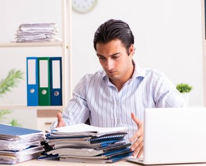 Young employee sitting at the office