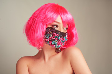 Girl with bright pink hair, anime, in a mask of flowers. Spring, joy, people should wear masks....