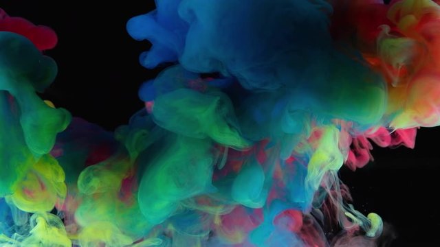 Color paint drops in water , abstract color mix , drop of Ink color mix paint falling on water Colorful ink in water, 4K footage, 