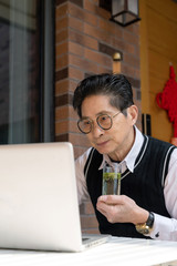 An Asian male wearing