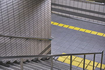 Obraz premium Escalator Detail with Yellow Safety Line, Urban Transit Texture