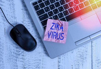 Writing note showing Zika Virus. Business concept for caused by a virus transmitted primarily by...